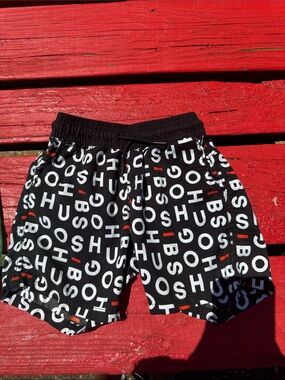 Hugo Boss Black Swim Shorts with White Logo Print and Red Accents